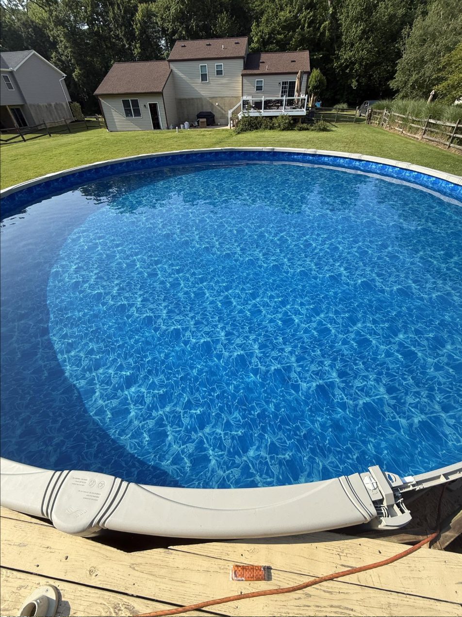 28-foot round above-ground pool, filled and ready for summer