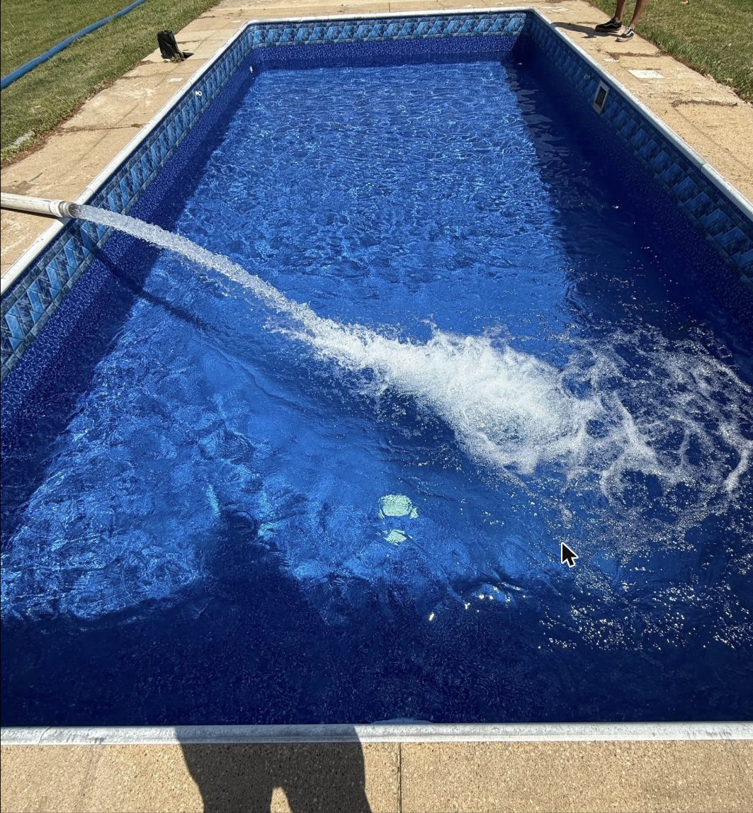 Pool being filled with a fresh water feature spray