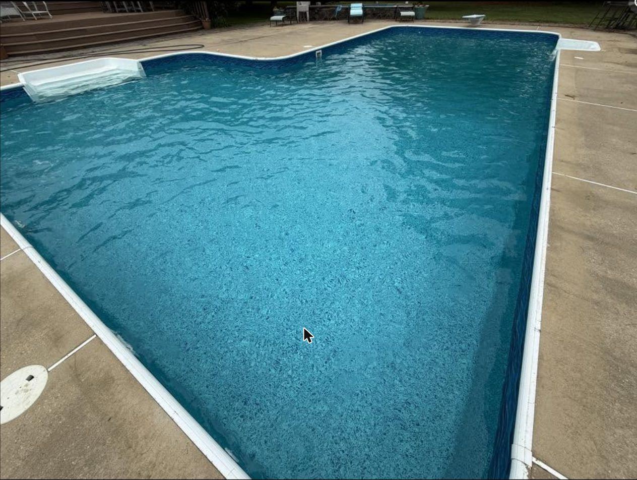 In-ground vinyl liner pool with diving board, freshly serviced